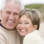 Couple at the beach smiling