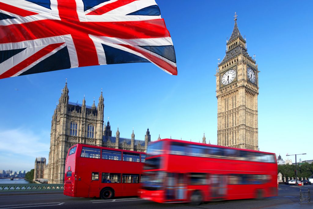 Big Ben with city bus and flag of England, London